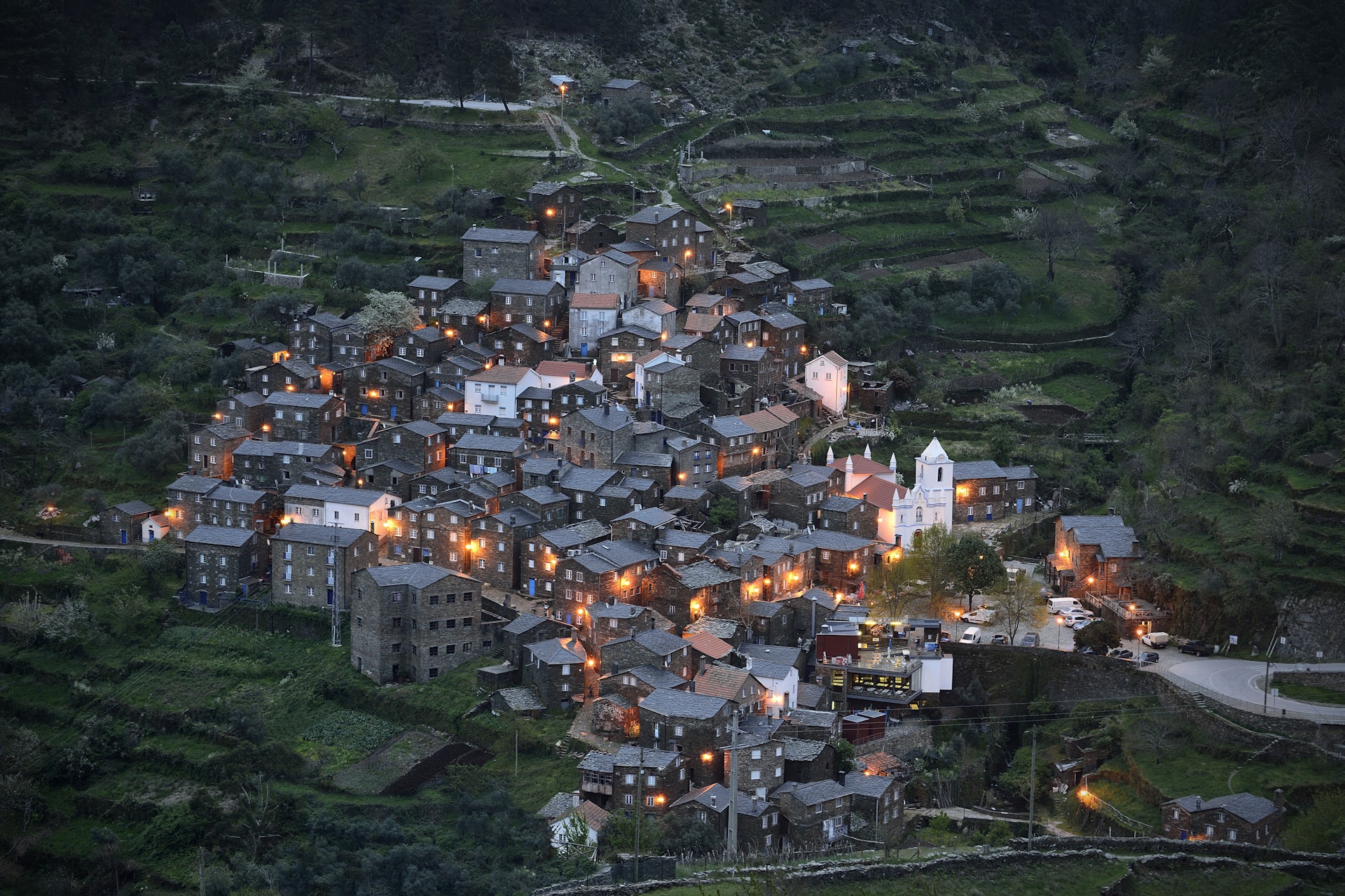 The village of Piódão in Portugal. The rural mountain village is built on a steep slope, and consists of a number of traditional stone houses.