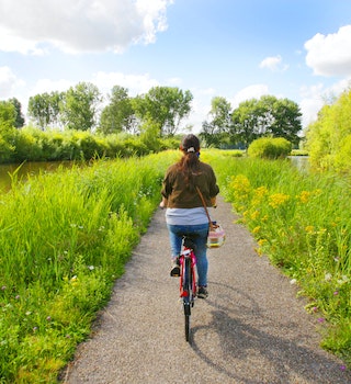 A girl riding bicycle during summer