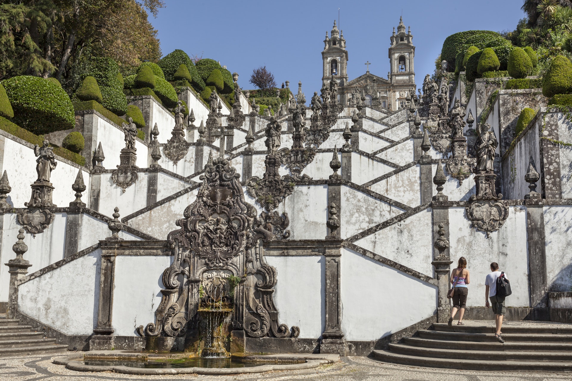 Tourists climbing the steps to Bom Jesus do Monte near Braga, Portugal