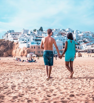 happy Young couple walking at the beach of Albufeira Algarve Portugal; Shutterstock ID 1025917321; your: Claire Naylor; gl: 65050; netsuite: Online ed; full: Portugal beaches
1025917321