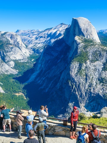October 9, 2014: Visitors gather at Glacier Point with the Half Dome mountain in the background.