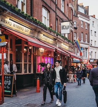 April 14, 2019: People walking past Ku Bar, one of the largest gay bars in London, located just off Leicester Square.