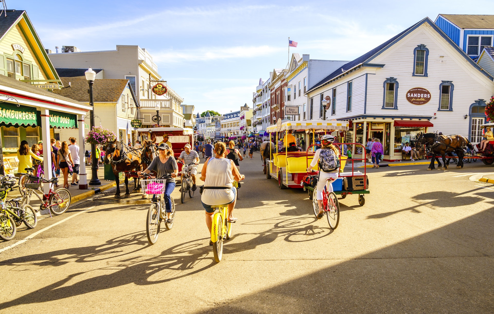 Visitors walk and ride bicycles at Market Street on Mackinac Island, Michigan
