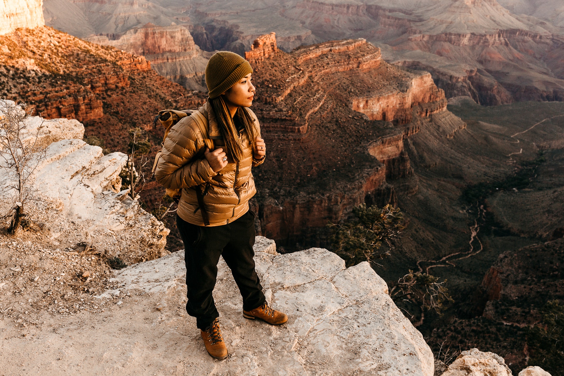 A woman looking out towards the Grand Canyon.